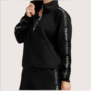 FA121 Peloton Uptown 1/2 zip sweatshirt in black with white letters size L
